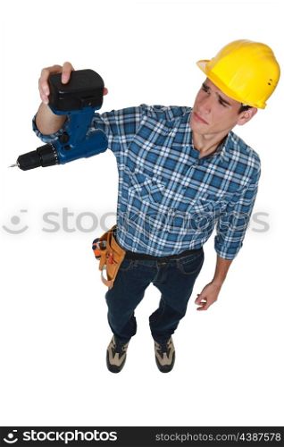 A construction worker sad about his broken drill.