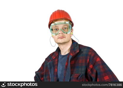 A construction worker wearing protective work wear for safety: a hard top, ear plugs and goggles.