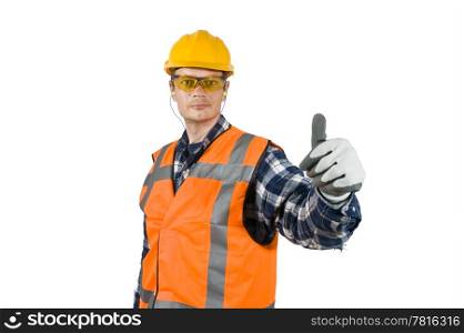 A construction worker, wearing the proper safety precautions, giving a thumbs-up, showing good practise.