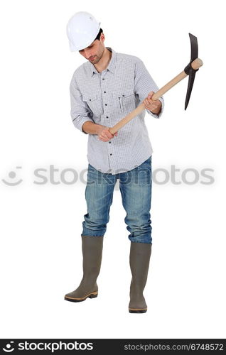 A construction worker with a pickaxe.