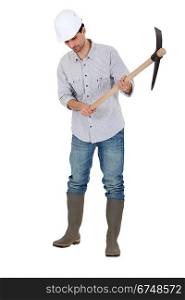 A construction worker with a pickaxe.