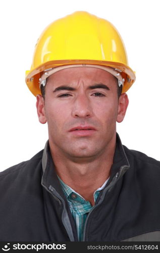 A construction worker with a weird expression.