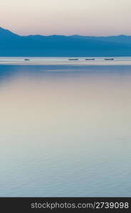 a convoy of a tug with barges at Baikal