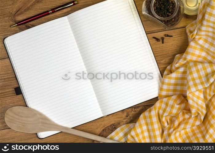 A Cooks Notebook on a farmhouse kitchen table - Space for Text