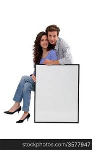 a couple and a white panel/ copyspace