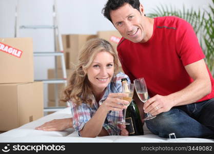 A couple celebrating with champagne.