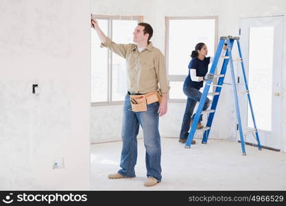 A couple doing building work