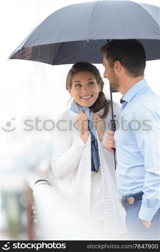 a couple during a rainy walk
