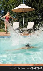 A couple having fun in a swimming pool