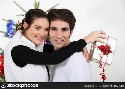 a couple hugging at Christmas time