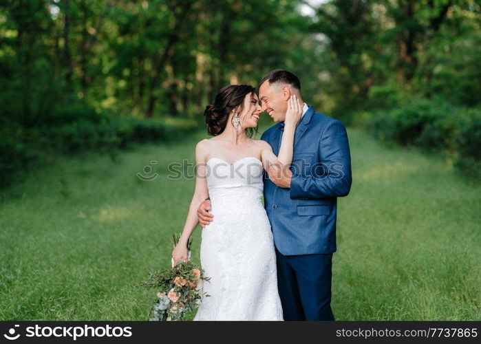 A couple in love a guy and a girl on a walk in the forest belt