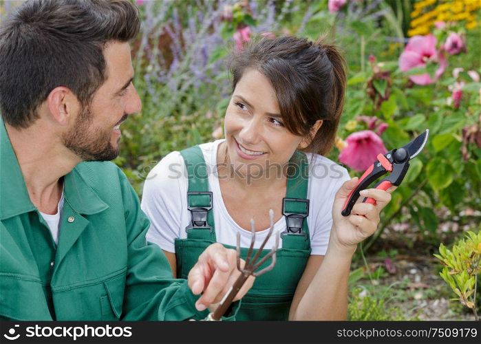 a couple is planting together