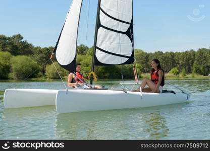 a couple is sailing boat