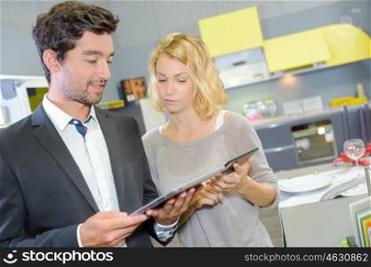 a couple looking at tablet