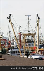 A couple of fish trawlers in a harbor