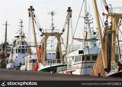 A couple of fish trawlers in a harbor