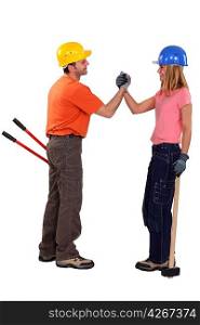 A couple of handyman shaking hands.