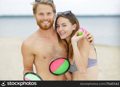 a couple playing beach game