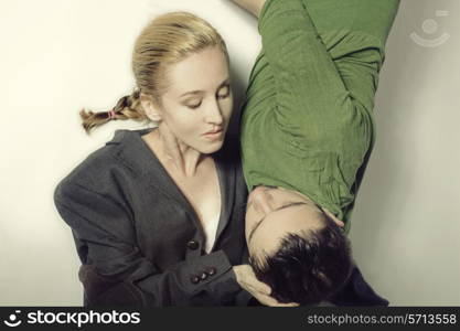 A couple young lovers lying on the floor