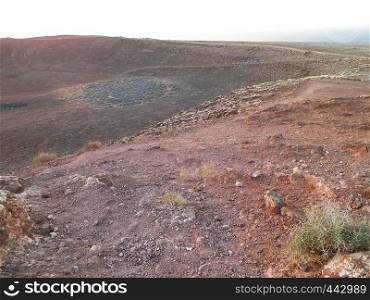 A crater on Montana Roja, Lanzarote, Canary Islands. Montana Roja is a volcano in Playa Blanca, Lanzarote Islands.. A crater on Montana Roja, Lanzarote, Canary Islands.