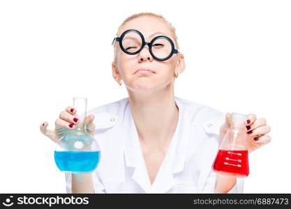 A crazy chemist in funny glasses with test tubes conducts experiments in the laboratory