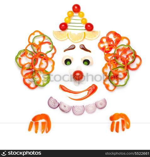 A creative food concept of a sad drama clown made of vegetables and fruits in a menu.