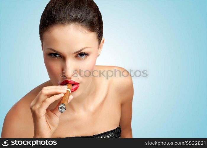 A creative portrait of a beautiful sexy rich woman smoking cigar.