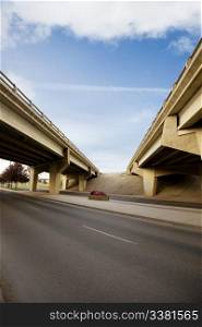 A crossing of two highways with a concrete overpass