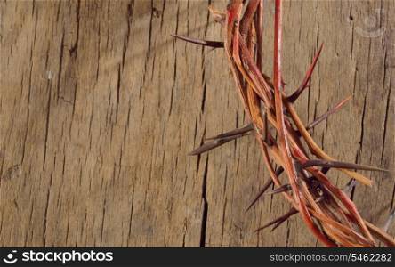 A crown of thorns on wooden background