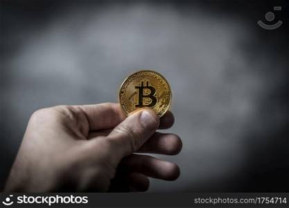 a crypto currency in a hand
