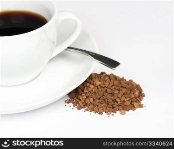 A Cup Of Black Coffee With A Pile Of Instant Granules To The Side