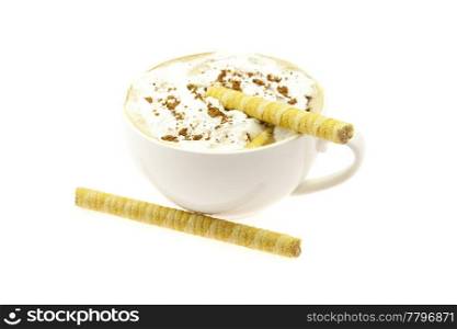 a cup of cappuccino and wafer rolls isolated on white