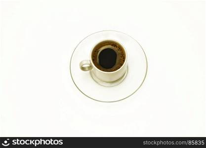 A cup of coffee on a glass transparent saucer on a white background