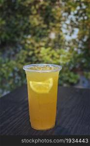 A cup of fresh orange juice with soda. fresh orange juice with soda
