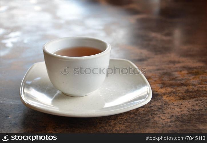 a cup of hot tea on table