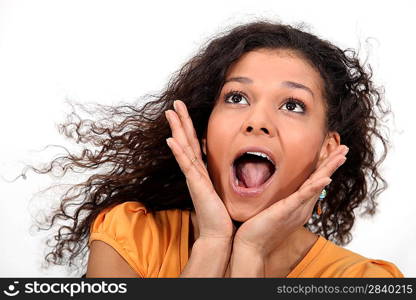 A cute African American woman screaming.