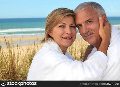 A cute middle age couple at the beach.