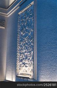 a decorative element from a plaster molding on the wall of the facade. decorative molding on the wall