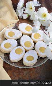 A delicate, melting in the mouth a homemade Easter biscuit made from sand in the form of an egg with a filling from a Kurdish lemon sprinkled with powdered sugar. An interesting idea for baking.