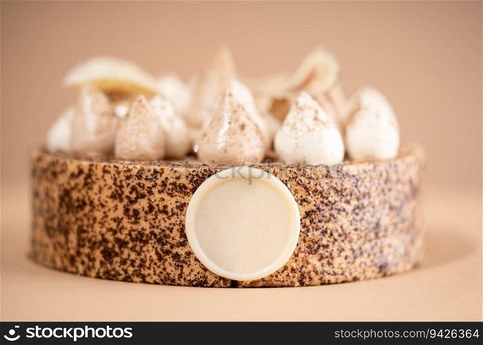 A delicious-looking dessert of a round cake on a brown plate, topped with a generous helping of fluffy white whipped cream. A cake sitting on top of a brown plate topped with whipped cream
