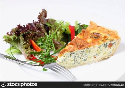 A delicious quiche made from spinach beet (aka Swiss chard or sea kale beet), leek and tomato, baked in an egg custard and served with a garden fresh salad.