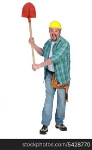 A delirious tradesman holding up a spade