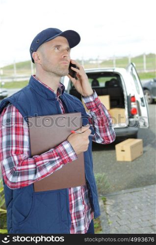 a delivery driver using telephone