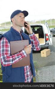 a delivery driver using telephone