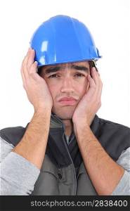 A depressed construction worker.