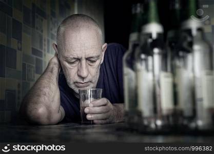 A desperate man falls into depression and becomes alcoholic and miserable. His addiction leads him to a state of loneliness and poverty. He has no hope and could be suicidal.