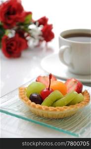 A dessert fruit tart with coffee