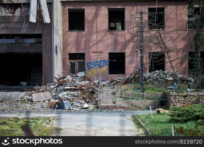 A destroyed building in the city of Mykolaiv due to a hit by a Russian rocket. The writing is on the wall we will live. Ukraine, April 2023