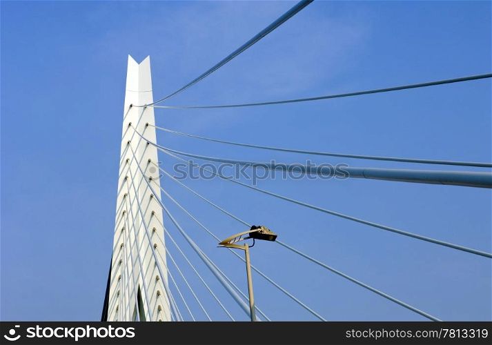 A detail of the suspension cables and bridge head of the Erasmus Bridge in Rotterdam, the Netherlands