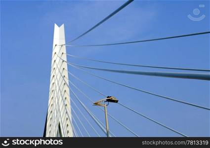 A detail of the suspension cables and bridge head of the Erasmus Bridge in Rotterdam, the Netherlands
